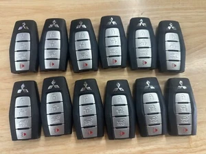 LOTE DE 12 LLAVES INTELIGENTES MITSUBISHI 4 BOTONES MANDOS A DISTANCIA OEM KR5MTXN1 - Imagen 1 de 2