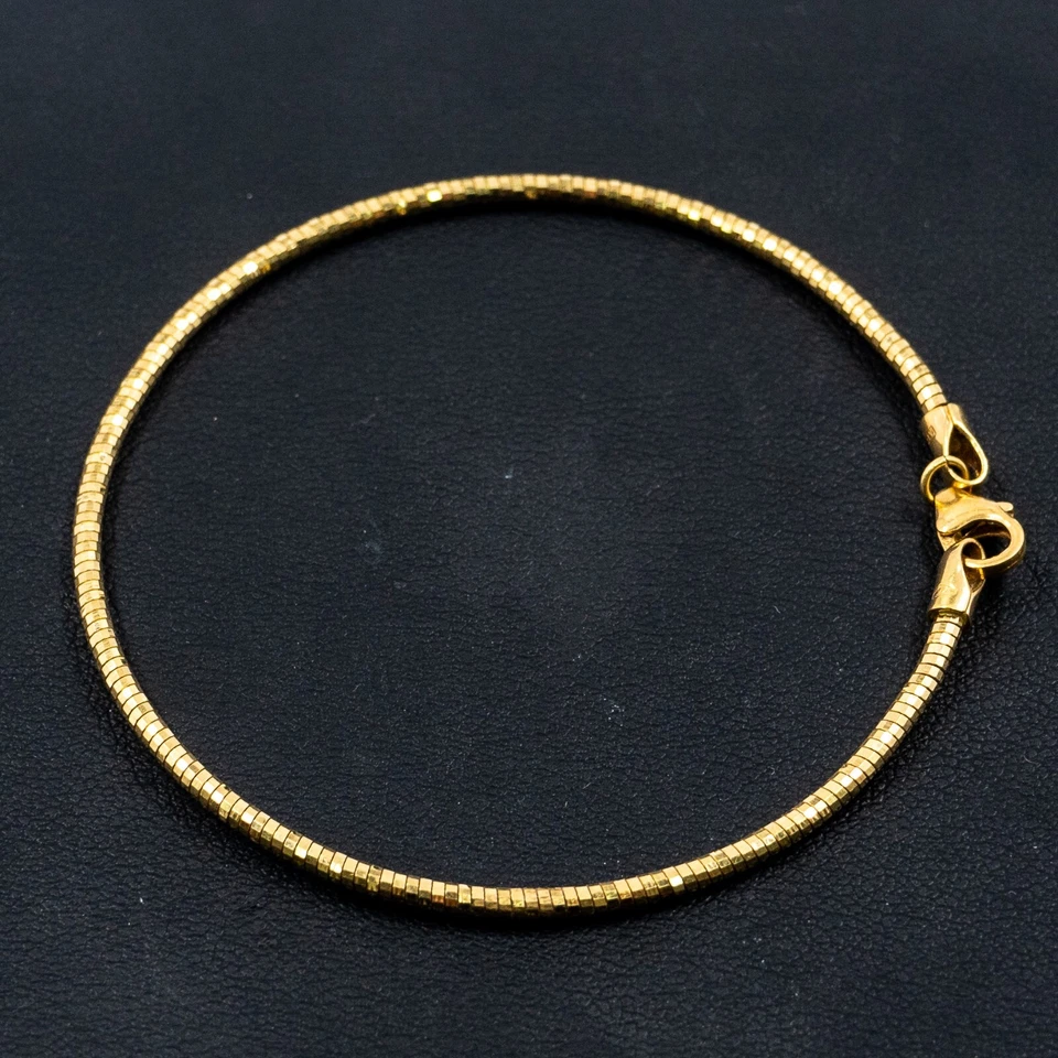 Brazalete redondo de oro amarillo de 18k Foto 1 de 4