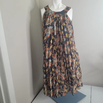 Vestido túnica grande Free People plisado cuello redondo sin mangas forro con botones Foto 1 de 4