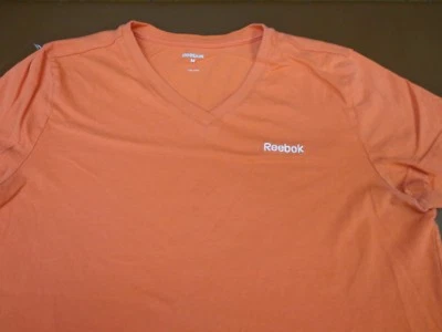 Camiseta para mujer Reebok cuello en V coral mediana Q6 Foto 1 de 4