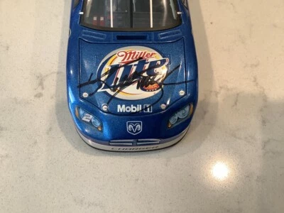 KURT BUSCH 2006 AUTOGRAPHED DODGE CHARGER MILLER LITE DIECAST & AUTOGRAPHED CARD - Image 1 of 4