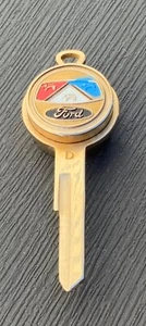 Ford Uncut Key Blank With Lion Crest & Shield w/ Coin/Token Bank Bow - Picture 1 of 5