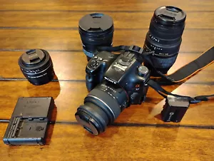 Sony A57 camera with 4 lenses and UV lens protectors - Picture 1 of 8