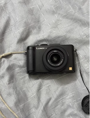 Panasonic LUMIX DMC-LX7 10.1MP 3.8x Optical Zoom blcak Digital Camera English - Image 1 of 4