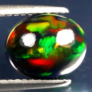 1.88 ct World class Oval Cabochon (10 x 8 mm) Ethiopian Flashing Black Opal - Picture 1 of 2