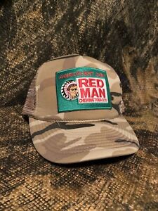 Red man patch on a Cobra old school camo trucker hat Vintage