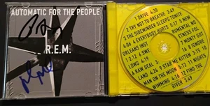 R.E.M. PETER BUCK MIKE MILLS DUAL SIGNED AUTOMATIC FOR THE PEOPLE CD PROOF PIC - Bild 1 von 4