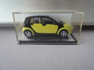BUSCH L.E. SMART FORFOUR PROMO in YELLOW model is PLASTIC - HO or 1:87 scale - Picture 1 of 2