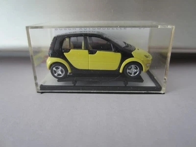 BUSCH L.E. SMART FORFOUR PROMO in YELLOW model is PLASTIC - HO or 1:87 scale - Image 1 of 2