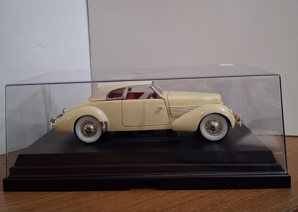 1936 Cord 810 Coupe yellow with cream top and red interior 1:18 Diecast Metal - Image 1 of 4