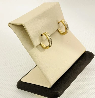 Pendientes tipo argolla Huggie de diamantes de oro amarillo de 14k Foto 1 de 4