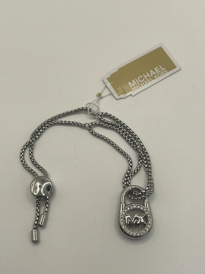 Pulsera Deslizante MICHAEL KORS NUEVA CON ETIQUETAS Tono Plata Cristal Pavé CANDADOS Foto 1 de 4