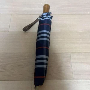 Folding Umbrella Burberry folding umbrella, navy, checkered One bone is broken. - Picture 1 of 5