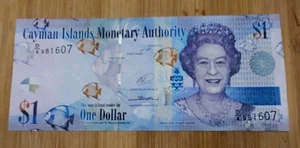 Billete de 1 dólar UNC 2014 Islas Caimán P 38e (prefijo D/4) Reina Isabel II - Imagen 1 de 2