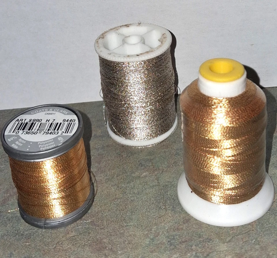 Lot of 3 Metallic Threads, 2 Gold 1 Silver Spools Mostly Full - Image 1 of 4