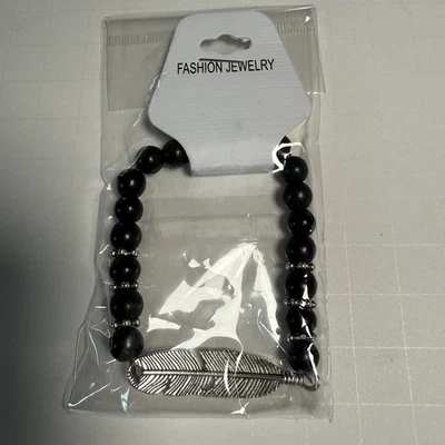 Fashion Jewelry Black Beaded Stretch Bracelet Silver Tone Feather Charm - Image 1 of 2