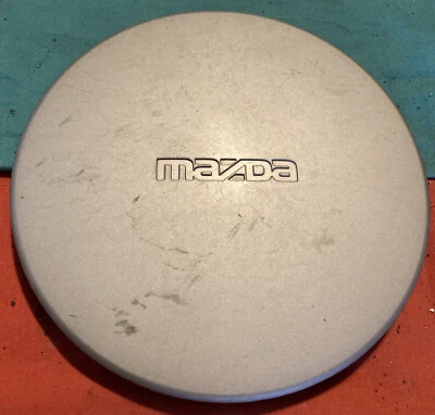 1990 年马自达 Protege SE 323 轮毂盖原始设备制造商保护套 6 1/2" dia B457 7502 — 第 1/4 张图片