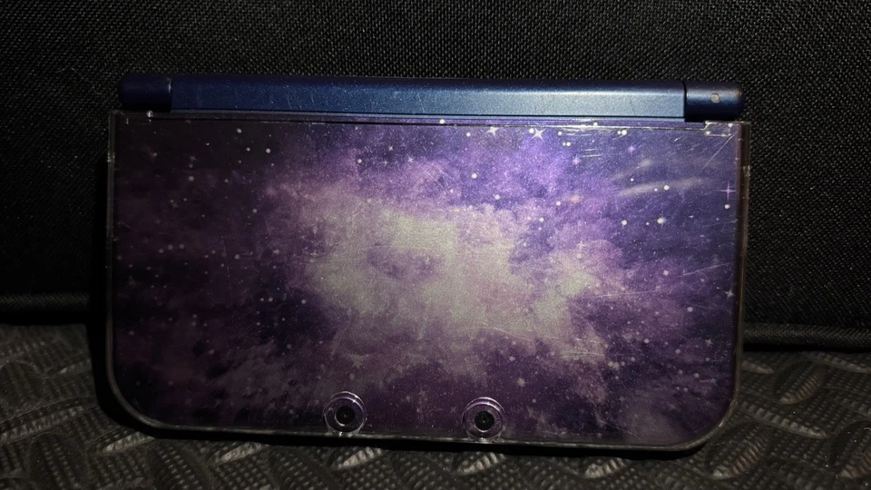 Sistema Nintendo 3DS XL Galaxy Edition con paquete Zelda Ocarina Of Time Foto 1 de 4
