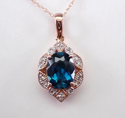 Oval Cut Simulated London Blue Topaz Halo Pendant Chain In 14k Rose Gold Plated - Image 1 of 4