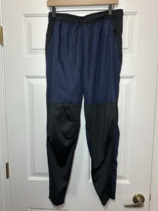Pantalones versátiles repelentes al agua talla M Nike Unlimited para hombre negros azules FB8601-010 - Imagen 1 de 4