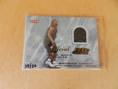 CAMISETA GEORGE LYNCH GOLD FEEL THE GAME USADA EN EL JUEGO #39/50 en 2000/01 Fleer Ultra Foto 1 de 2