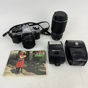 Canon AE-1 Program 35mm Film Camera w/2 Lenses Speedlite Flash & Manual Tested - Picture 1 of 24