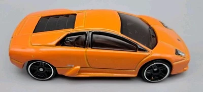 Литой под давлением оранжевый автомобиль Lamborghini Murcielago Dream Garage от Hot Wheels в масштабе 1:64 - Изображение 1 из 4