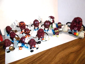 14 KONVOLUT ENDE 80ER JAHRE CALIFORNIA ROSINEN FIGUREN 13-PVC & 1 KUNSTSTOFF WALKER AUFZIEHBAR - Bild 1 von 5