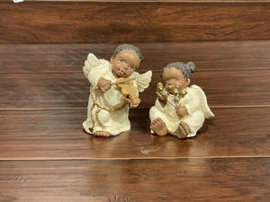 Set statuine angelo afroamericano bambino che suona violino stelle ebano figure arte - Foto 1 di 8