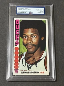 JUNIOR BRIDGEMAN 1976-77 TOPPS ROOKIE SIGNED AUTOGRAPHED CARD PSA/DNA CERTIFIED - Picture 1 of 2