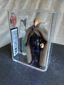 GRADED VINTAGE STAR WARS - UKG not AFA 85% 90% - LUKE SKYWALKER JEDI - SNAP CAPE - Bild 1 von 9