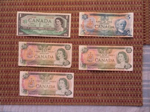 Moneta canadese 2 1979 $20 1 1979 $5 1 1967 $1 - Foto 1 di 4