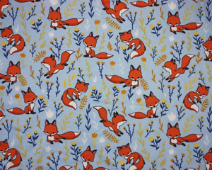 Foxes and Flowers Cotton Jersey Fabric on a Light Blue Background- Material