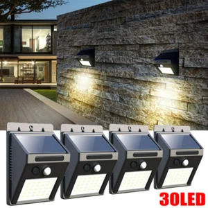 4x SUPER BRIGHT SOLAR POWERED DOOR FENCE WALL LIGHTS LED OUTDOOR GARDEN LIGHTING - Picture 1 of 12