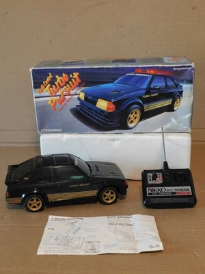 Винтажный радиоуправляемый полицейский автомобиль Nikko Ford Escort Turbo Pursuit Япония рабочий см. видео - Изображение 1 из 4