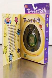Bondia Tamagotchi vintage vedi attraverso verde e giallo nuovo - Foto 1 di 3
