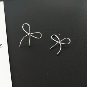 Super cute silver tone alloy cut out bow stud earrings - Picture 1 of 4