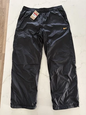 Pantalones tejidos Nike Culture Of Football ajuste térmico FZ0531-010 para hombre talla grande” Foto 1 de 4