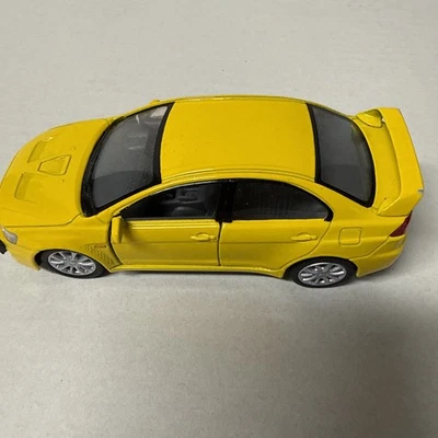 Kinsmart Mitsubishi Lancer Evolution X 2008 - coche modelo diecast 1:36 - amarillo de 5" Foto 1 de 4
