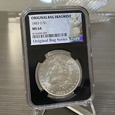 1883 O Morgan ORIGINAL BAG FRAGMENT Silver Dollar NGC MS 64 NEW Bag Series Coin
