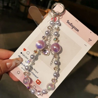 Correa de muñeca ajustable con cuentas de cristal para teléfono celular móvil Foto 1 de 4