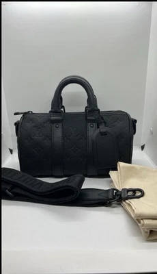 Bandolera Louis Vuitton Monograma Taurillon Keepall 25 Noir Negra Foto 1 de 4