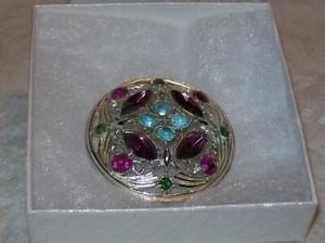 SILVER TONE ROUND METAL BROOCH W/ GREEN, RUBY, PURPLE, & TEAL FLORAL DESIGN - Picture 1 of 2