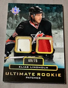 2013-14 Ultimate Rookie Gold /75 Dual Patch Elias Lindholm Jersey RC #UR-JEL - Picture 1 of 2
