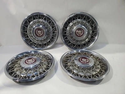 Cadillac Brougham 1988 1992 OEM juego de 4 cubiertas de rueda con herramienta muestra desgaste Foto 1 de 4