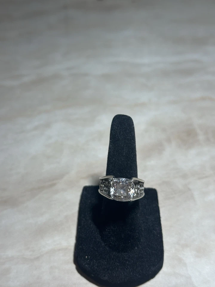 sterling silver ring with a large central cubic zirconia stone and small stone 5 - Image 1 of 4