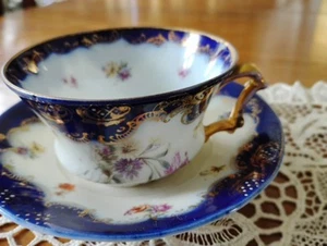 VINTAGE ÖSTERREICH TASSE/UNTERTASSE FEINPORZELLAN - FLOW BLAU FLORALES DESIGN GOLDAKZENTE - Bild 1 von 6