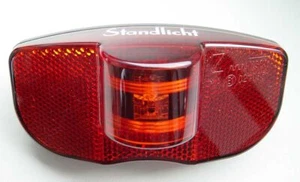 LED Dynamo Fahrrad Rücklicht BUMM 319 50/80mm Gepäckträger Standlicht schwarz - Bild 1 von 1
