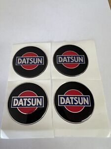 4  EMBLEMS STICKERS BLACK/RED DATSUN SIZE  44mm OR 1.75"  DIAMETER