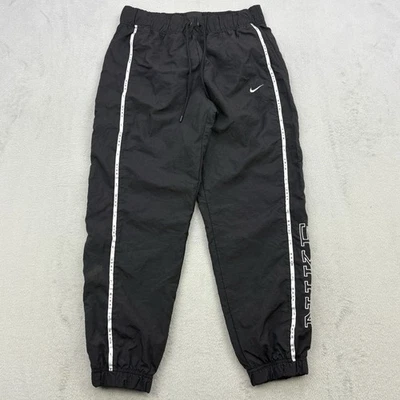 Pantalones Nike para mujer medianos negros holgados con puños Swoosh Y2K 100 % nailon logotipo deletreado Foto 1 de 4